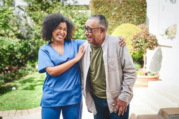 A care worker working with an elderly resident.