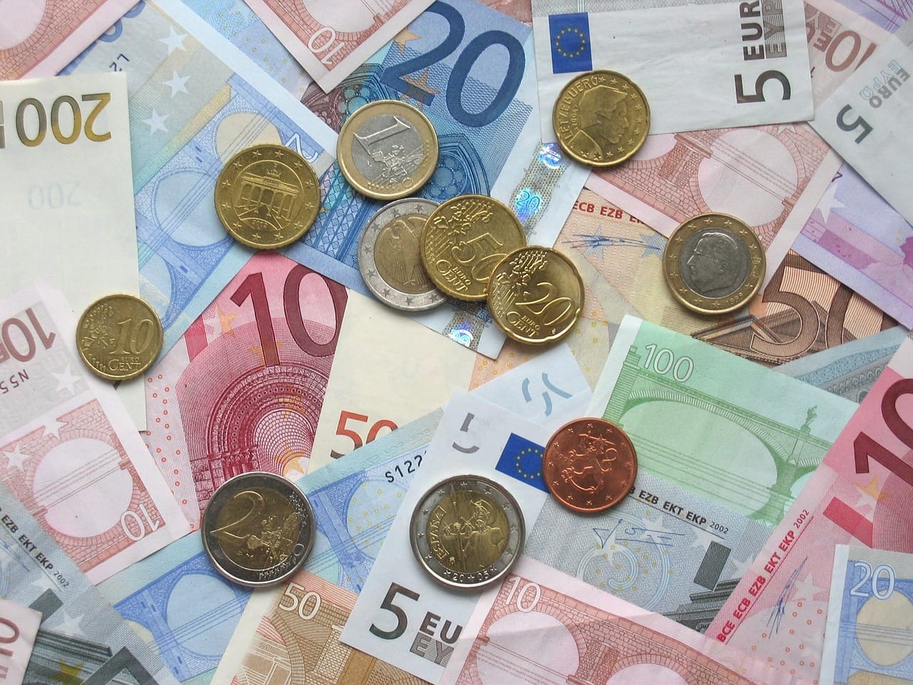 A collection of Euro banknotes and coins.
