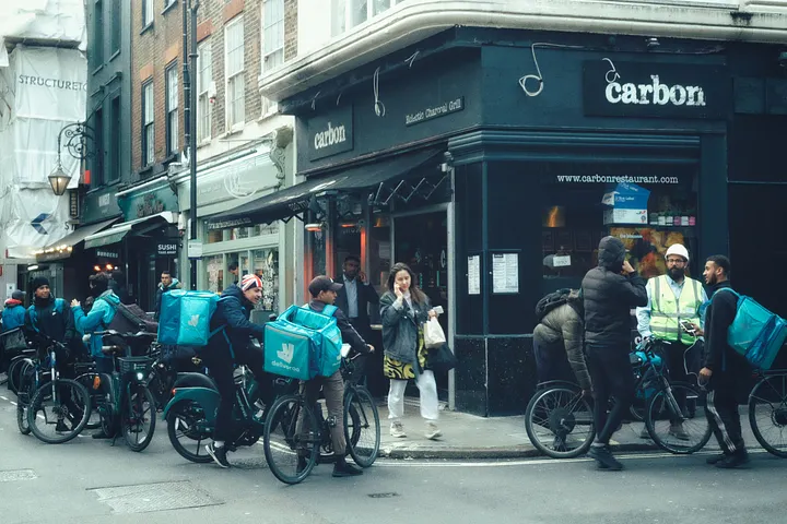 A group of Deliveroo delivery drivers in London