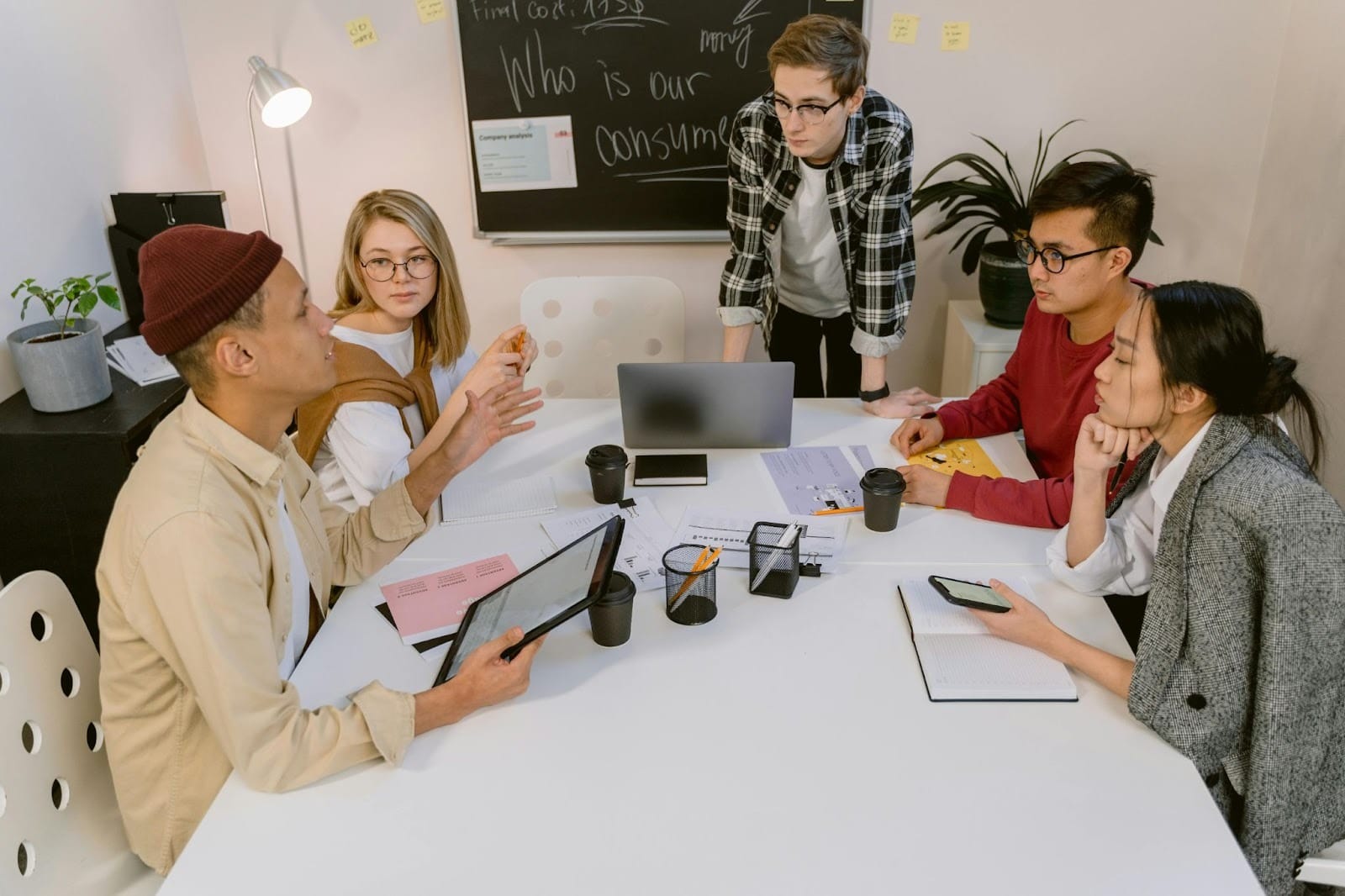A group of colleagues working together at a co-working space